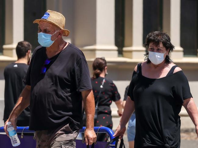 MELBOURNE, AUSTRALIA - NewsWire Photos 23 JANUARY 2022 : People line up for their booster vaccination at the Royal Exhibition Building as the omicron covid-19 variant spreads throughout Australia. Picture : NCA NewsWire / Ian Currie