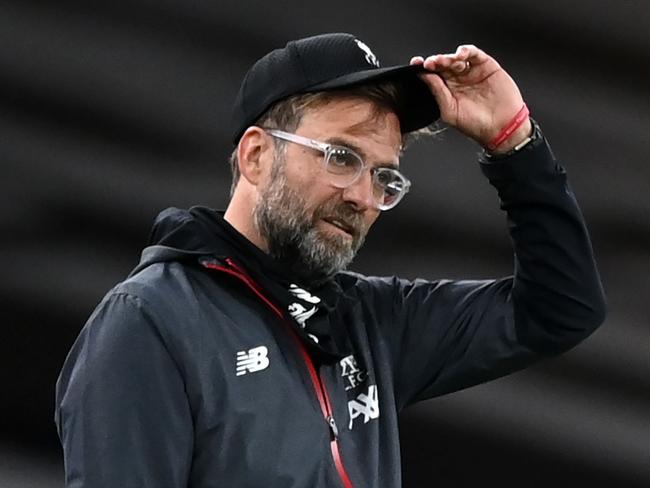 Liverpool's German manager Jurgen Klopp gestures on the touchline during the English Premier League football match between Arsenal and Liverpool at the Emirates Stadium in London on July 15, 2020. (Photo by Shaun Botterill / POOL / AFP) / RESTRICTED TO EDITORIAL USE. No use with unauthorized audio, video, data, fixture lists, club/league logos or 'live' services. Online in-match use limited to 120 images. An additional 40 images may be used in extra time. No video emulation. Social media in-match use limited to 120 images. An additional 40 images may be used in extra time. No use in betting publications, games or single club/league/player publications. /