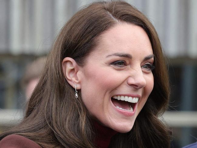 Britain's Catherine, Princess of Wales (L) reacts as she is reunited with an old school teacher of hers following the tour of the National Maritime Museum Cornwall on February 9, 2023 in Falmouth, England. (Photo by Chris Jackson / POOL / AFP)