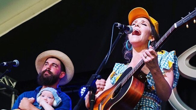 Fanny Lumsden with brother and bandmate Thomas on stage with her baby son Rupert. Picture: Supplied.