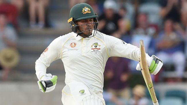 Usman Khawaja celebrates his century.