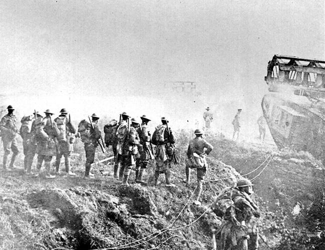 Diggers of the 11th Brigade mill around one of the last tanks in operation while advancing on the Hindebnberg Line in October 1918.