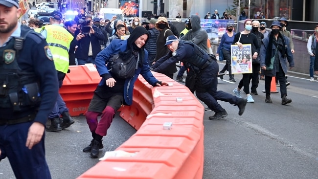Demonstrators used objects such as rubbish bins, milk crates and construction barricades to stop the flow of traffic. Picture: NCA NewsWire / Jeremy Piper