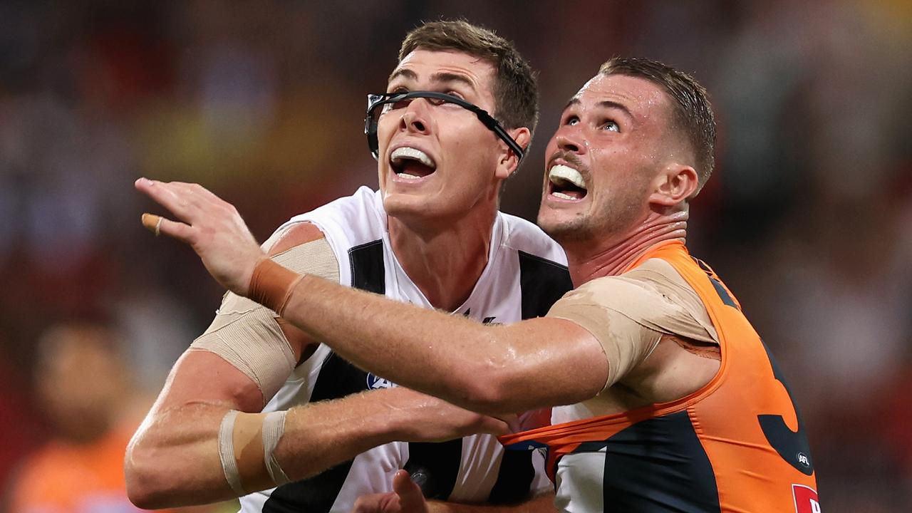SYDNEY, AUSTRALIA - MARCH 09: Mason Cox of the Magpies and Kieren Briggs of the Giants contest the ball during the AFL Opening Round match between Greater Western Sydney Giants and Collingwood Magpies at GIANTS Stadium, on March 09, 2024, in Sydney, Australia. (Photo by Cameron Spencer/Getty Images)