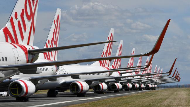 Grounded Virgin Australia aircraft parked at Brisbane Airport. Picture: Darren England/AAP