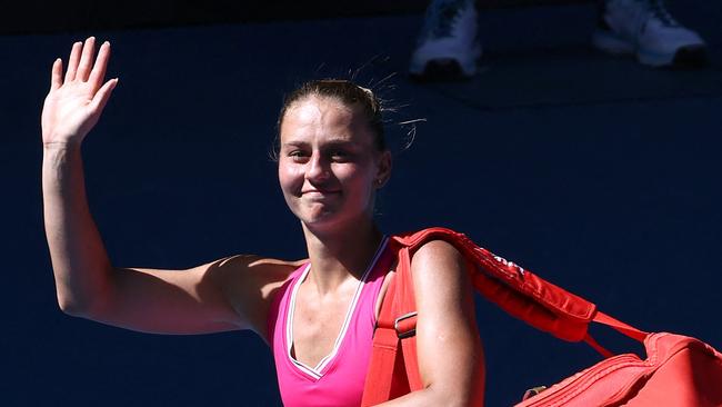 Ukraine's Marta Kostyuk waves as she walks off after losing against USA's Coco Gauff during their women's singles quarter-final match on day 10 of the Australian Open tennis tournament in Melbourne on January 23, 2024. (Photo by David GRAY / AFP) / -- IMAGE RESTRICTED TO EDITORIAL USE - STRICTLY NO COMMERCIAL USE --