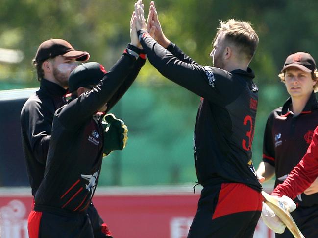 Premier Cricket: Essendon v Melbourne: Matthew Doric (3rd right) of Essendon celebrates with team mates after taking the wicket of Meyrick Buchanan of MelbourneSaturday, January 23, 2021, in Essendon, Victoria, Australia. Picture: Hamish Blair