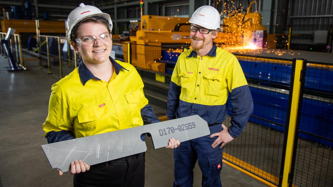 BAE Systems Maritime Australia project controller Tayesha Papa - the Hunter-class frigate program's 1000th employee - pictured with fabrication manager Mick Noy at the Osborne shipyard. Picture: James Elsby