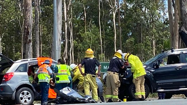 Emergency crews work at the scene of the crash on Bruce Highway near David Drive, Curra on Thursday.