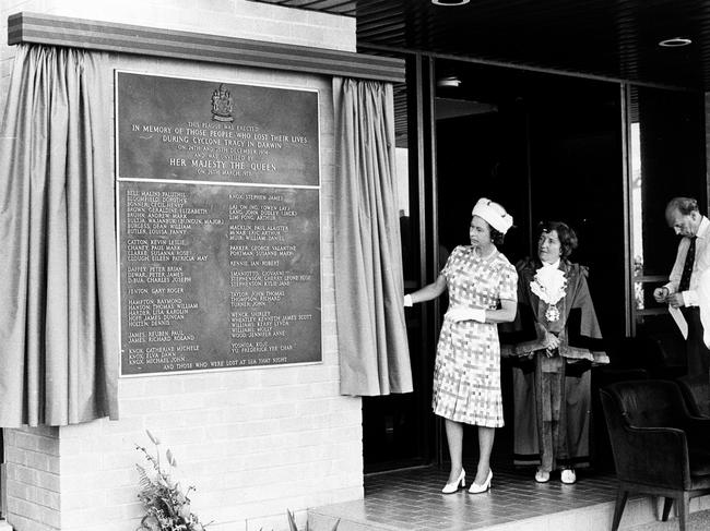 The Queen unveils a plaque commemorating the lives lost during Cyclone Tracy during her visit in 1977. Picture: NT News staff photographer.