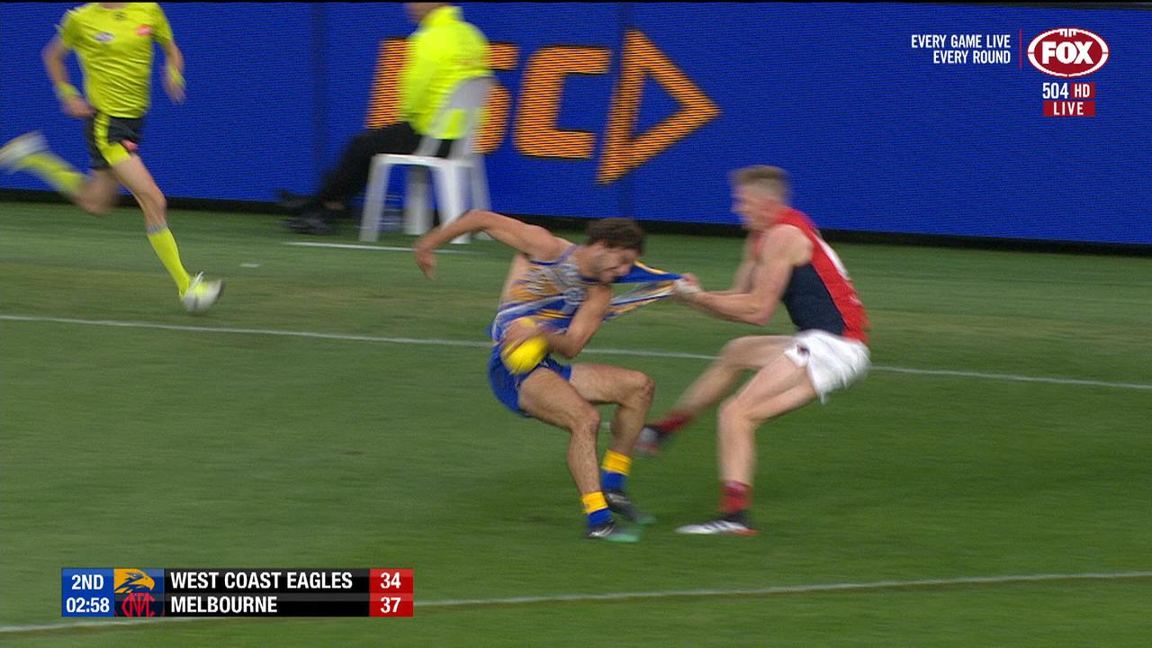 Jack Petruccelle is caught by Sam Frost, and has his guernsey torn off in the process.