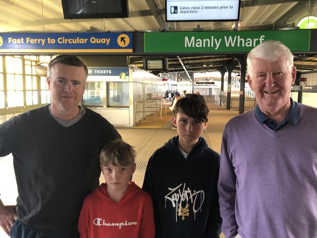 Stephen Mackinnon (left), from Durban in South Africa, with John Mackinnon, from Durban (right) with John's grandsons Ethan and Shaun Marshall, of Seaforth, at Manly Wharf. Picture: Jim O'Rourke