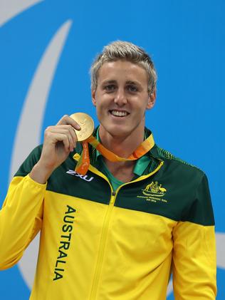 RIO DE JANEIRO, BRAZIL - SEPTEMBER 09: Gold medalist Brenden Hall of Australia celebrates on the podium at the medal ceremony Men's 400m Freestyle - S9 on day 2 of the Rio 2016 Paralympic Games at the Olympic Aquatics Stadium on September 9, 2016 in Rio de Janeiro, Brazil. (Photo by Friedemann Vogel/Getty Images)