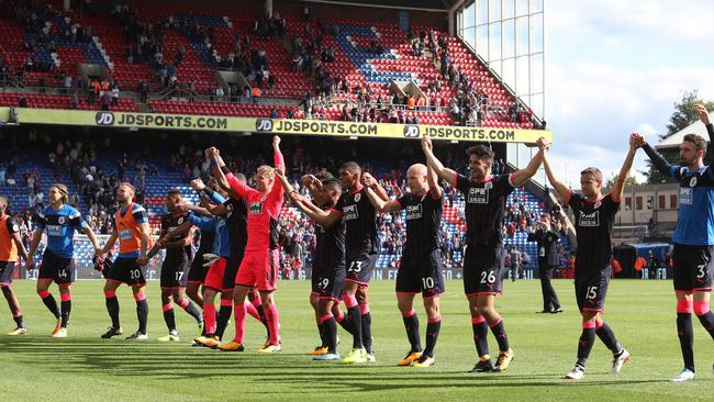 The Huddersield Town team celebrate victory.