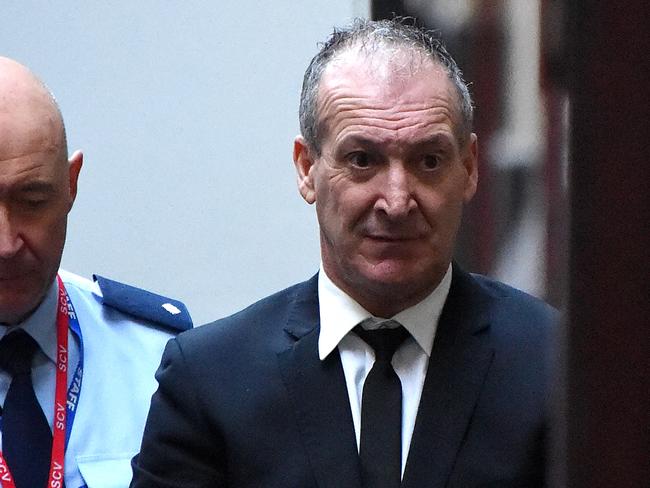 Angelo Russo arrives in the prison van at the Mebourne Supreme Court. Picture: Nicole Garmston