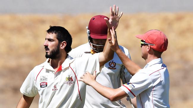 Cameron Valente of Adelaide celebrates taking his fourth wicket during the Premier Cricket semi-final between Tea Tree Gully and Adelaide at Pertaringa Oval on Saturday. Picture: AAP Image AAP/Mark Brake