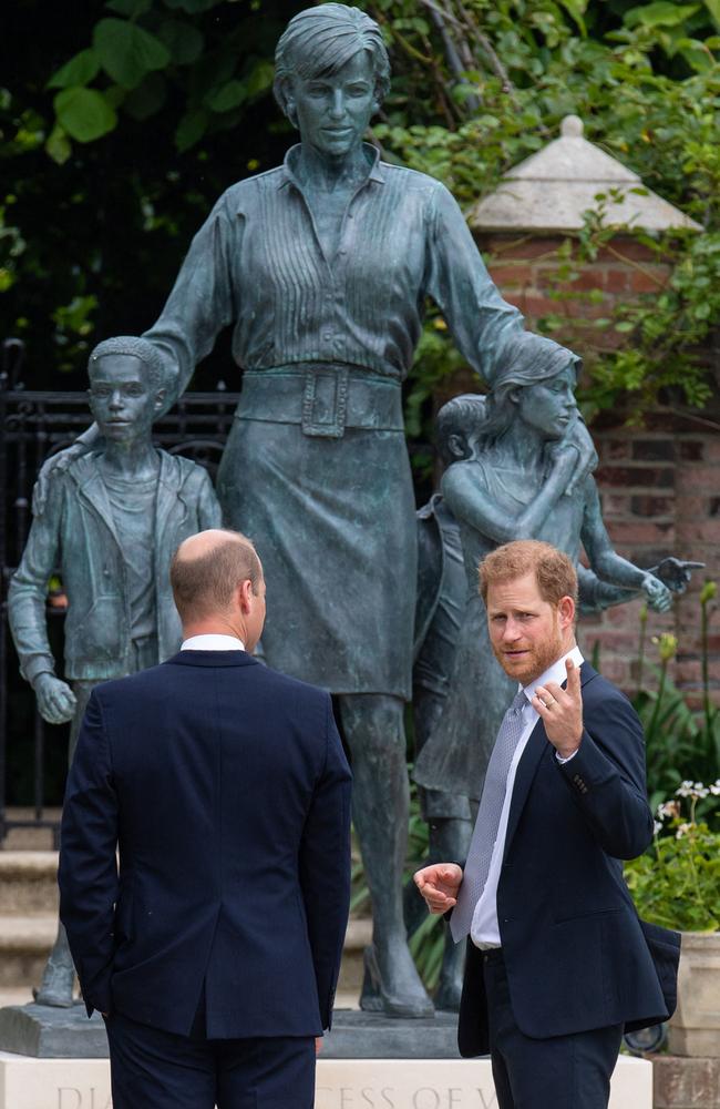 Prince William, Duke of Cambridge (L) and Britain's Prince Harry, Duke of Sussex with the statue of their mother, Princess Diana. Picture: AFP