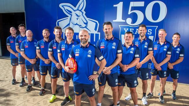 North Melbourne's coaching panel has undergone major change in the past 18 months. Rhyce Shaw (centre) with coaching staff, from left: Heath Scotland, Michael Firrito, David Loader, Leigh Adams, Brendan Whitecross, Jason Lappin, Rhyce Shaw, Jade Rawlings, Jarred Moore, Jared Rivers, Gavin Brown, and Brent Harvey. Picture: Jay Town