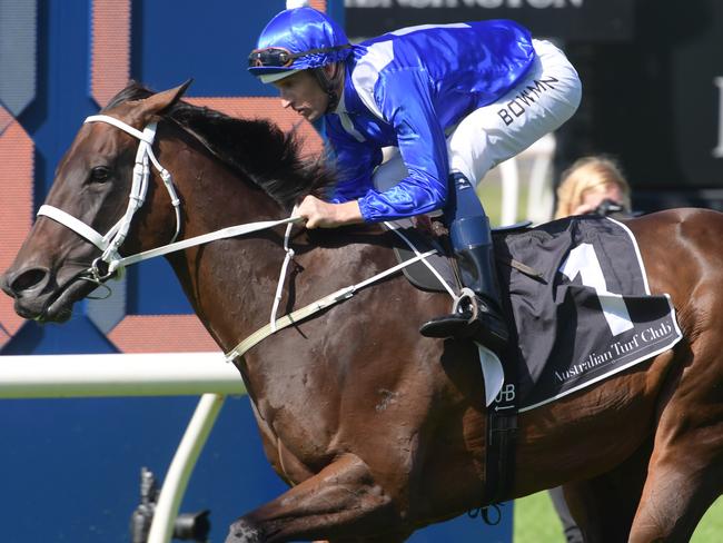 Hugh Bowman and Winx stretch out down the home straight for the early arriving spectators.