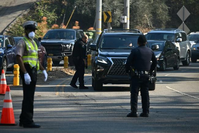 Police are setting up checkpoints to control who goes in and out of areas affected by the major fires burning around Los Angeles