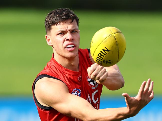 MELBOURNE, AUSTRALIA - JUNE 04: Marcus Windhager of the Saints handballs during a St Kilda Saints AFL training session at RSEA Park on June 04, 2024 in Melbourne, Australia. (Photo by Quinn Rooney/Getty Images)