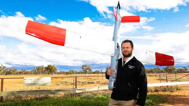 Marcus Ehrlich with one of the military-grade drones being trialled in rural Australia to detect invasive pests on farms.