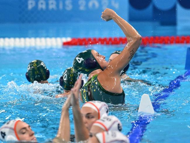 The Aussies celebrate their remarkable shootout victory. Picture: Andreas SOLARO / AFP