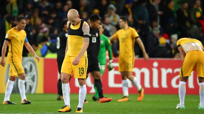 MELBOURNE, AUSTRALIA — SEPTEMBER 05: Aaron Mooy of the Socceroos and his teammates react as they leave the field at full time after the 2018 FIFA World Cup Qualifier match between the Australian Socceroos and Thailand at AAMI Park on September 5, 2017 in Melbourne, Australia. (Photo by Scott Barbour/Getty Images)