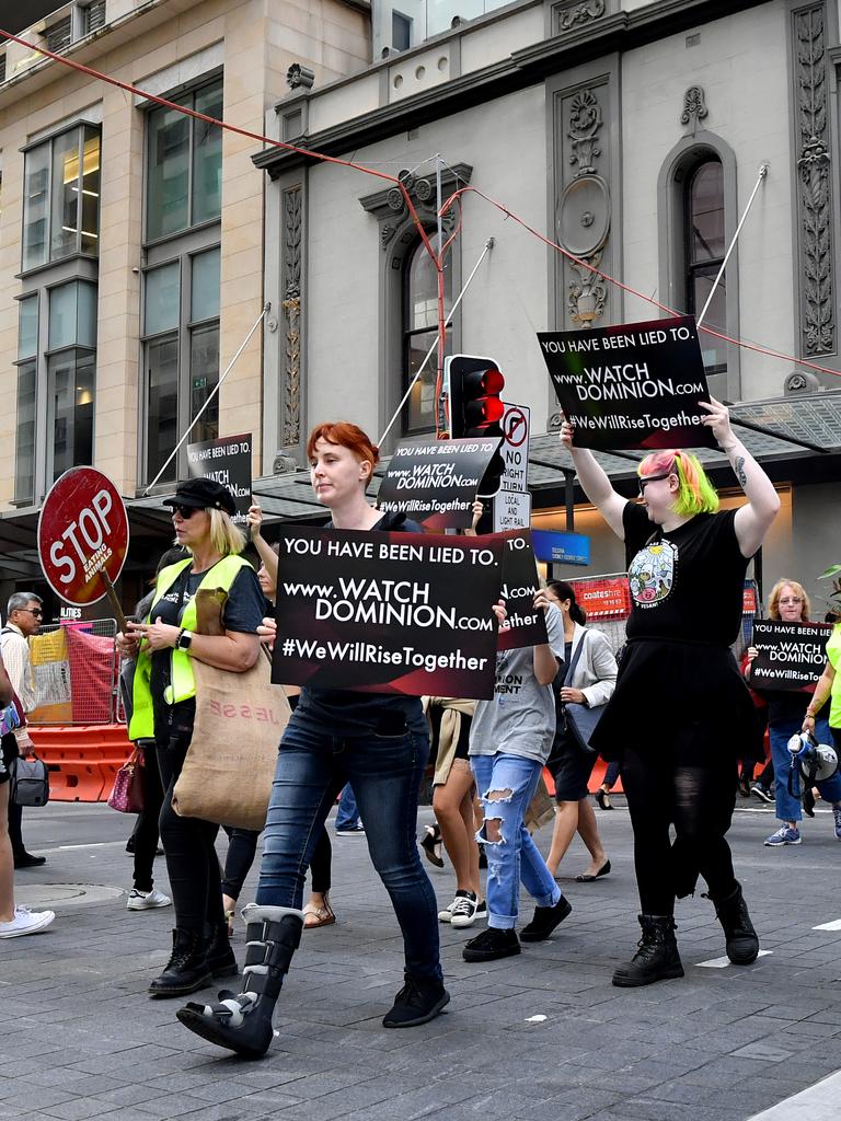 Animal rights protesters march through the business district in Sydney. Picture: AAP Image/Joel Carrett