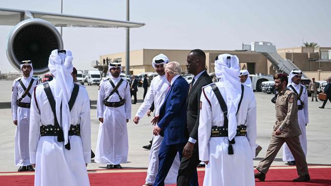 Qatar's Emir Sheikh Tamim bin Hamad al-Thani accompanies US President Donald Trump to his aeroplane at the end of the Qatari leg of his regional tour. Picture: AFP