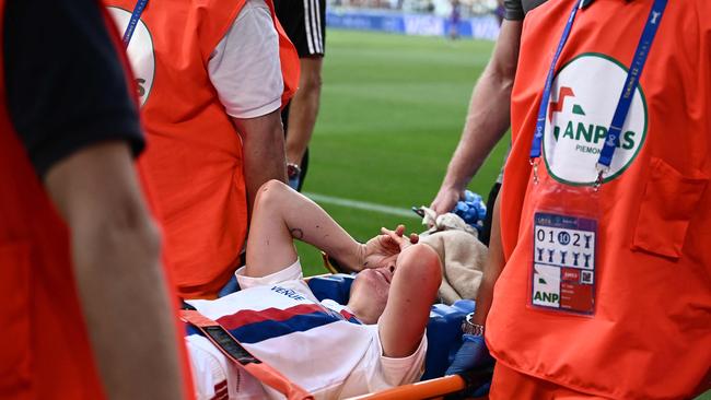 Lyon's Australian defender Ellie Carpenter is carried on a stretcher after injuring her ACL.