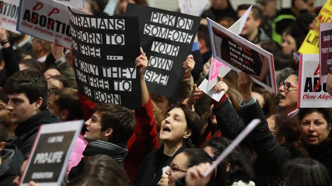 Protesters hold placards against the Reproductive Health Care Reform Bill 2019. Picture: Justin Lloyd