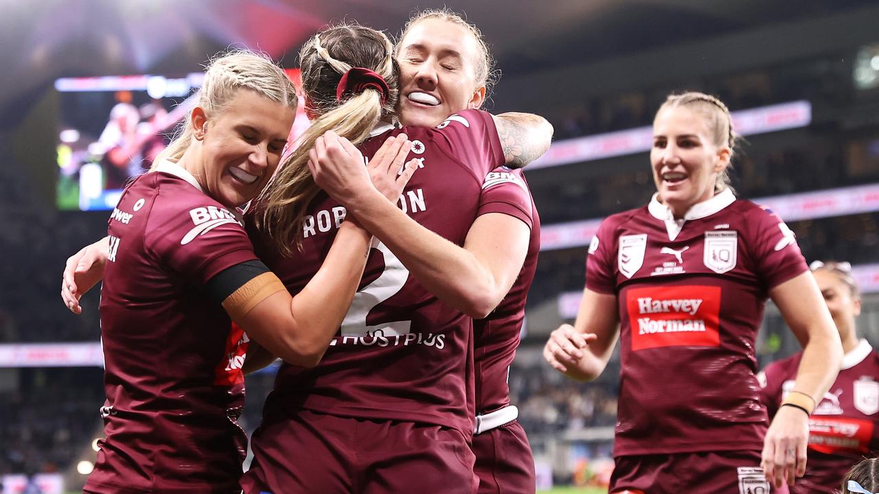Julia Robinson of the Maroons celebrates with her teammates after scoring a try (Photo by Mark Kolbe/Getty Images)