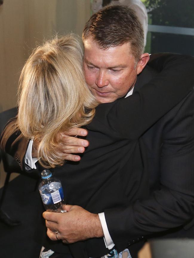 Pert embraces his wife, Andi. Picture: Getty