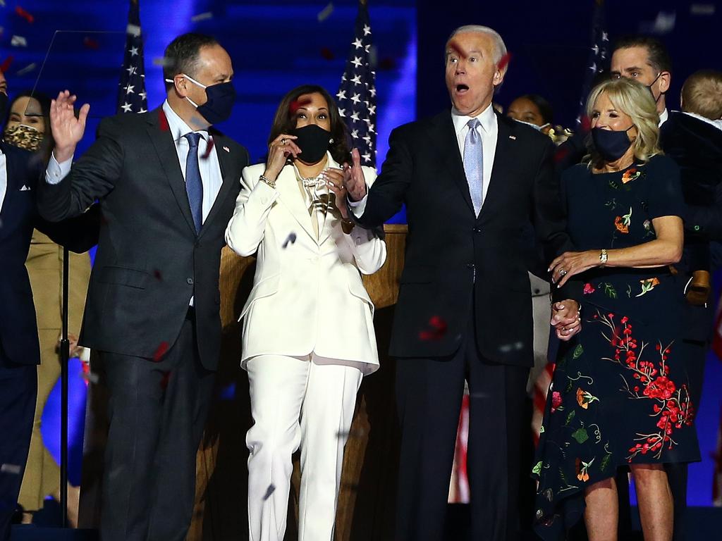 President-elect Joe Biden, Jill Biden, Vice President-elect Kamala Harris and husband Doug Emhoff wave to crowd on stage after Biden's address to the nation. Picture: Tasos Katopodis