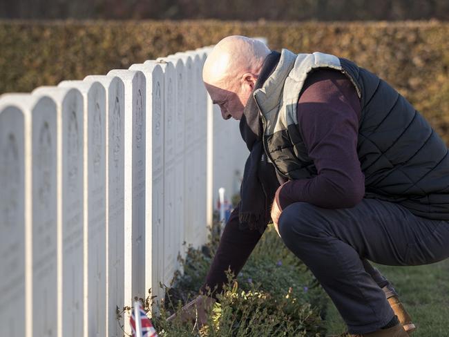 Tony and Debbie Sullivan, of Glenelg in Adelaide visited his grave for the first time at Crucifix Corner Cemetery in Villers-Bretonneux. Picture: Ella Pellegrini