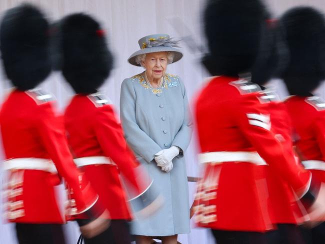 (FILES) In this file photo taken on June 12, 2021 Britain's Queen Elizabeth II watches a military ceremony to mark her official birthday at Windsor Castle in Windsor. - Queen Elizabeth II on February 6, 2022, becomes the first British monarch to reign for 70 years, heralding the start of her Platinum Jubilee year despite her retreat from public view. But the landmark date this weekend will see little fanfare, as the 95-year-old monarch traditionally spends the anniversary of the death of her father in private. (Photo by Chris Jackson / POOL / AFP)