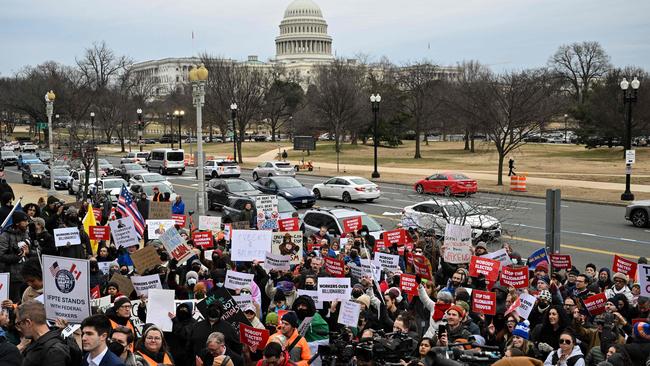 People protest against Elon Musk's DOGE outside of the US Department of Labor near the US Capitol. Picture; AFP.