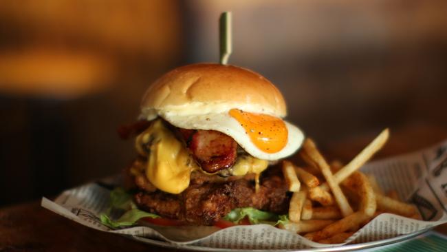 The Double Cheeseburger 'hacked' with maple bacon, Mac n’ Cheese, fried chicken and an egg from Crooked Tailor's Pimp My Burger sessions held on Sundays from 4pm. Picture: Crooked Tailor