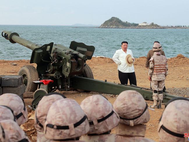 North Korea's leader Kim Jong-un (C) attending as the North Korean People's Army frontline long-range artillery division and air force squadron. Picture: AFP