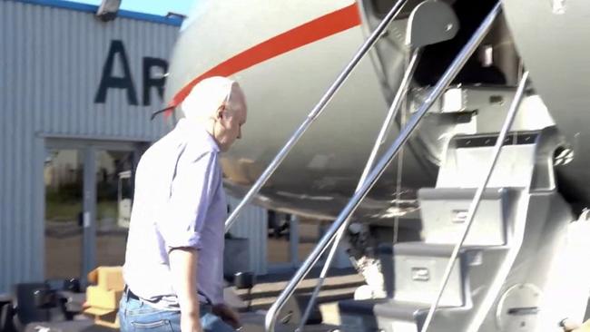 WikiLeaks founder Julian Assange boards a private jet en route to the Sapian where he will front a US Federal Court. Picture: Supplied