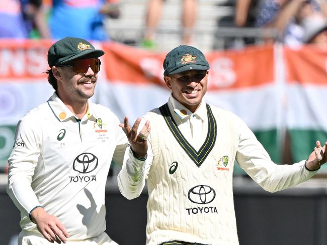 Australiaâs Usman Khawaja (R) celebrates with a teammate his catch to dismiss India's Nitish Kumar Reddy during the first day of the first Test cricket match between Australia and India at the Optus Stadium in Perth on November 22, 2024. (Photo by SAEED KHAN / AFP) / -- IMAGE RESTRICTED TO EDITORIAL USE - STRICTLY NO COMMERCIAL USE --