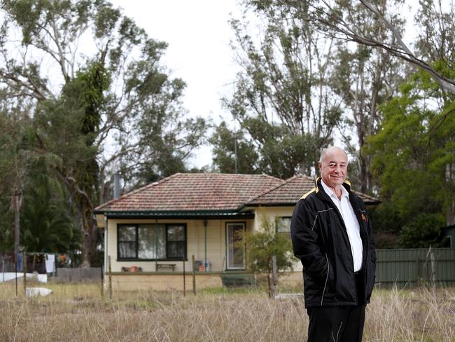 Real estate agent Charlie Cini with a $3.6 million house at Catherine Field. Picture: Carmela Roche