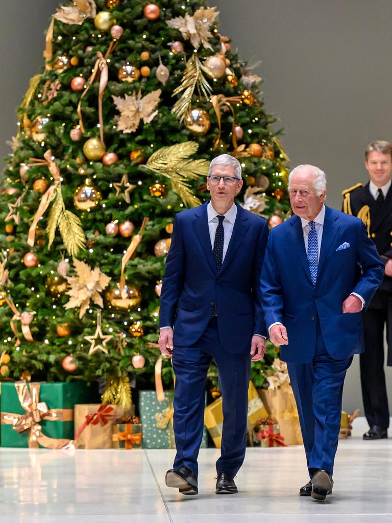 King Charles III an Apple Chief Executive Tim Cook. Picture: AFP