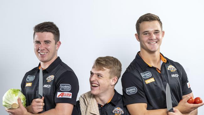 Jake Simpkin, right, was sharing a home with fellow development players Jock Madden and Reece Hoffman at the start of the year, learning life schools together, including cooking and cleaning..