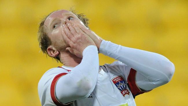 Newcastle Jets'€™ David Carey reacts after receiving a yellow card during the round 1 A-League match between Wellington Phoenix and Newcastle Jets at Westpac Stadium, Wellington, New Zealand, Sunday, Oct. 11, 2015. (AAP Image/ SNPA, Ross Setford) NO ARCHIVING, EDITORIAL USE ONLY