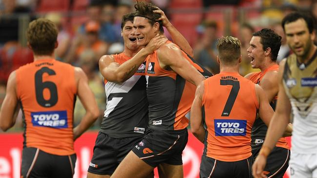 Rory Lobb is mobbed by teammates after kicking a goal during the Giants’ big win over the Hawks. Picture: Getty Images