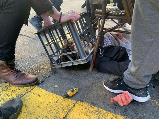 Bystanders detained Ney using a milk crate and chair until police arrived.