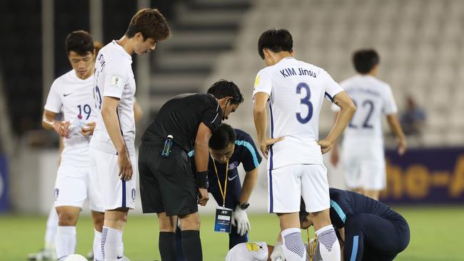 South Korea's Son Heungmin receive medical treatment.