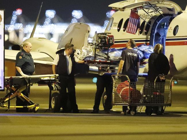 An injured person from an explosion at Grosvenor coal mine at Moranbah pictured arriving at the Royal Flying Doctors Service, Brisbane 6th of May 2020.   This is the second flights to arrive after an explosion at the mine left five people seriously injured. (AAP Image/Josh Woning)